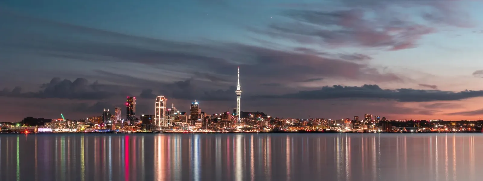 Night view of the Auckland city skyline and Sky Tower, representing the New Zealand study destination