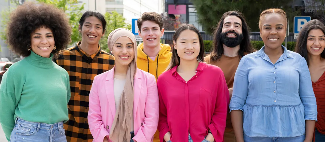 Multicultural group of students smiling, reflecting the welcoming and diverse international student community in New Zealand