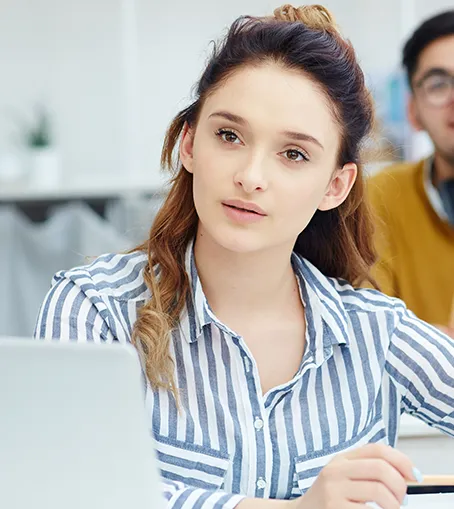 Group of graduates throwing hats in the air, symbolizing the career goals supported by NZ Study Advisers.